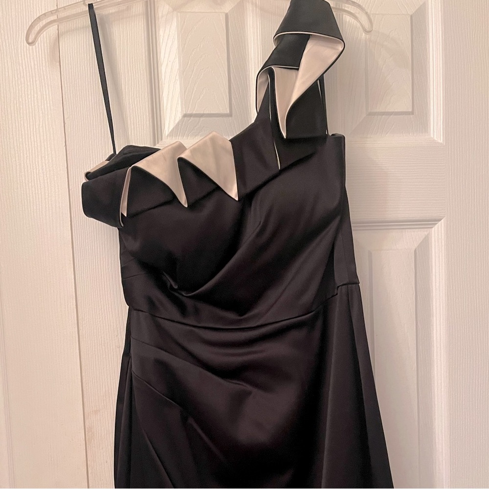 Black and cream fitted one shoulder cocktail dress.